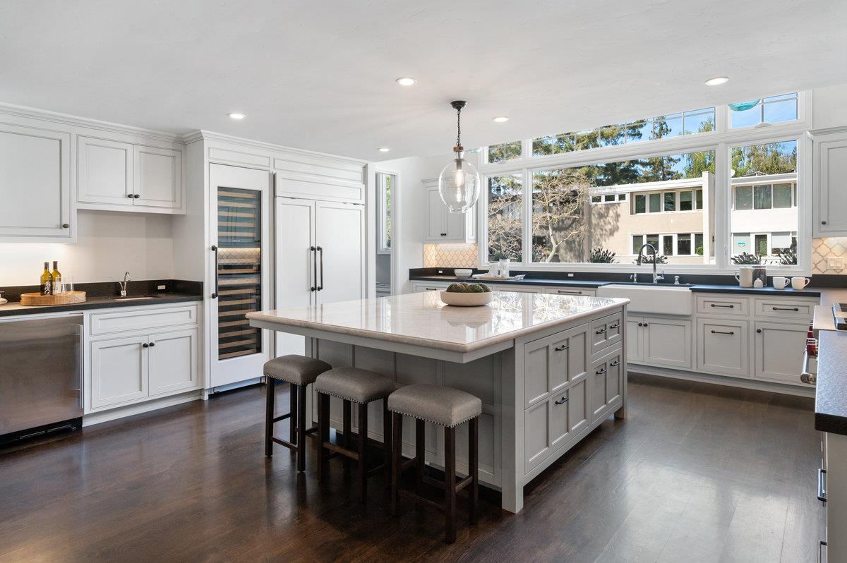 171 Forest Lane Menlo Park, CA 94025 - Photo 3 of 16 a kitchen with a sink stove and cabinets