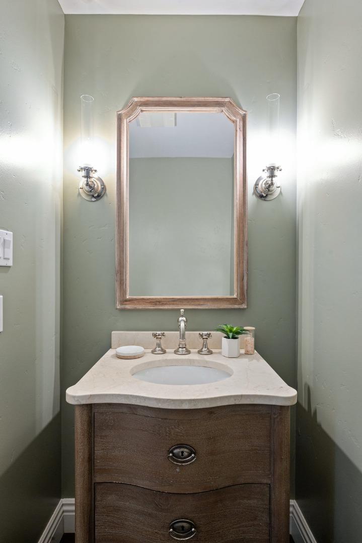 171 Forest Lane Menlo Park, CA 94025 - Photo 6 of 16 a bathroom with a sink vanity and a mirror