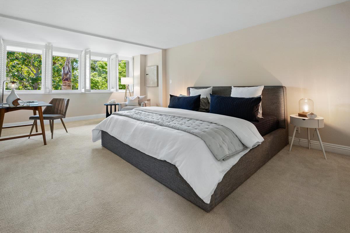171 Forest Lane Menlo Park, CA 94025 - Photo 9 of 16 a spacious bedroom with a bed and chair