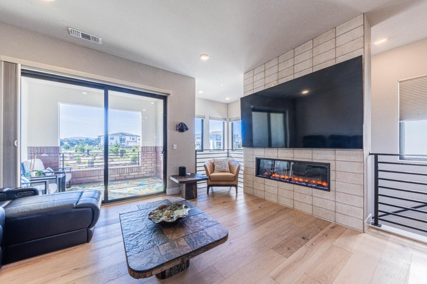 135 8th Street Marina, CA 93933 - Photo 25 of 69 a living room with furniture and a flat screen tv