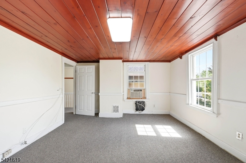 104 Maple Avenue, Unit 2 Morristown, NJ 07960 - Photo 11 of 23 an empty room with windows