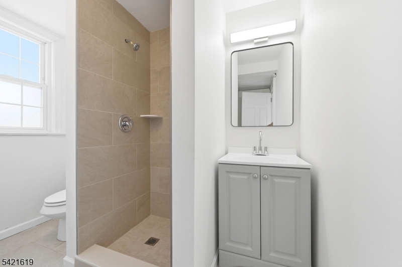 104 Maple Avenue, Unit 2 Morristown, NJ 07960 - Photo 16 of 23 a bathroom with a sink a toilet and shower