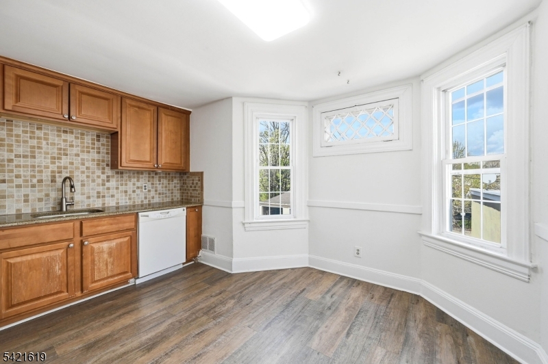104 Maple Avenue, Unit 2 Morristown, NJ 07960 - Photo 17 of 23 a view of a kitchen with a sink dishwasher and wooden floor