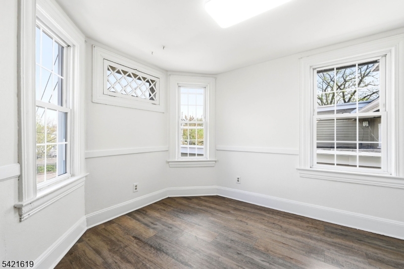 104 Maple Avenue, Unit 2 Morristown, NJ 07960 - Photo 20 of 23 a view of a livingroom with wooden floor and a window
