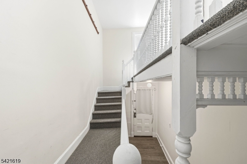104 Maple Avenue, Unit 2 Morristown, NJ 07960 - Photo 6 of 23 a view of a hallway with wooden floor and entryway