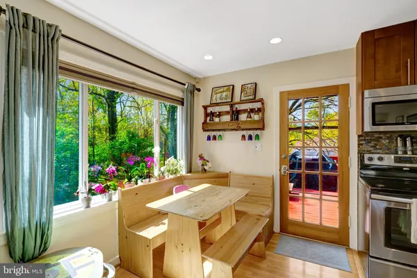 a view of a dining room with furniture window and outside view
