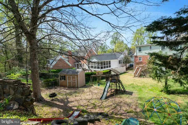 a view of a house with a yard and sitting area