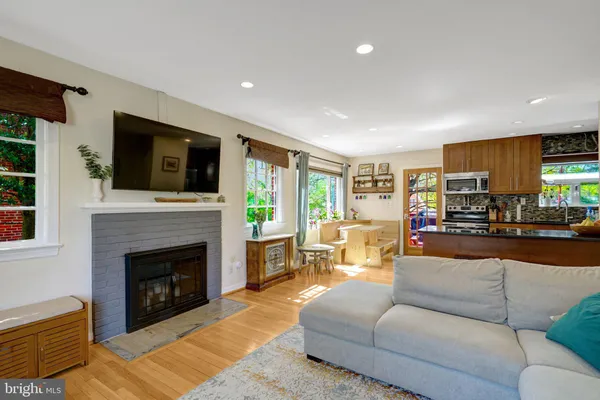 a living room with furniture fireplace and flat screen tv