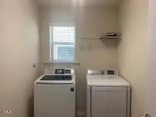 a room that has a window and a washer