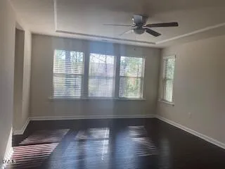 wooden floor in an empty room with a window