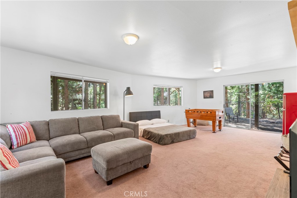676 Rhine Road Lake Arrowhead, CA 92352 - Photo 12 of 20 a living room with furniture and a large window