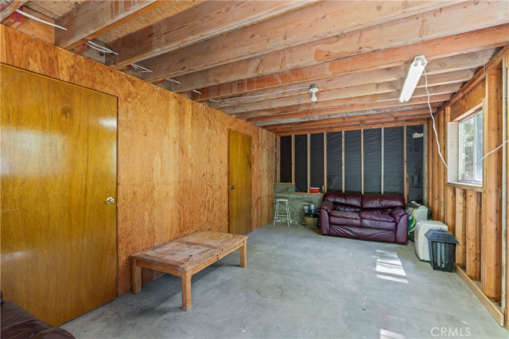 676 Rhine Road Lake Arrowhead, CA 92352 - Photo 18 of 20 a backyard of a house with outdoor seating