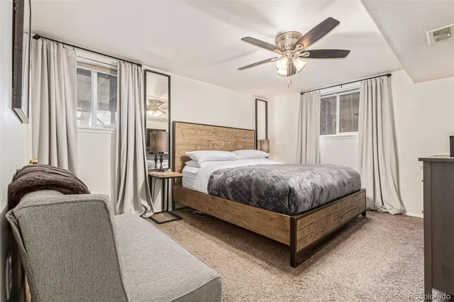 a bedroom with a bed and window