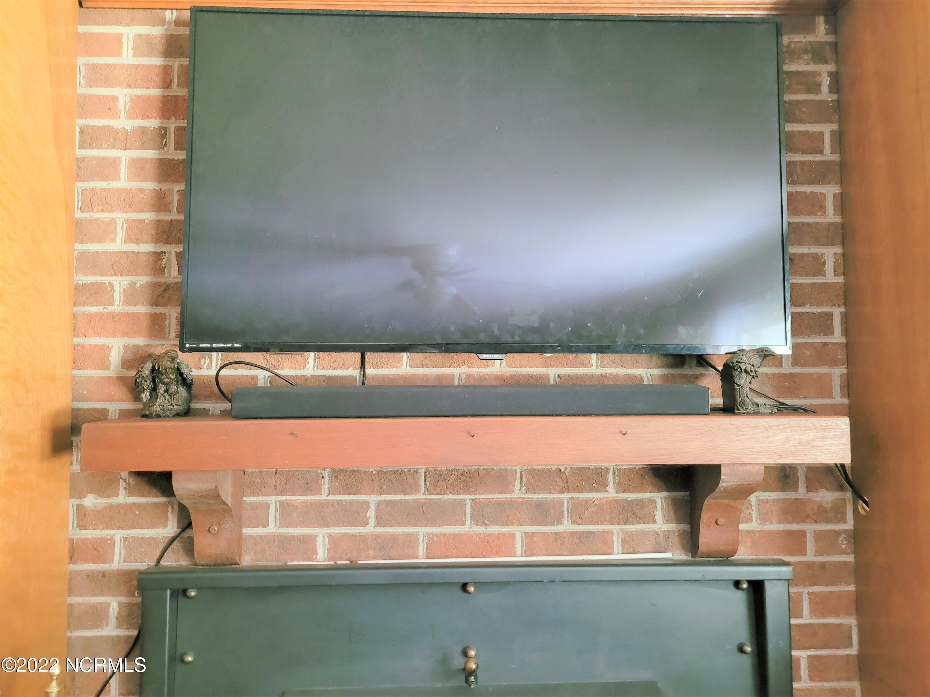 303 Little Rossie Road New Bern, NC 28560 - Photo 10 of 28 Mantle over Woodstove in Living Room