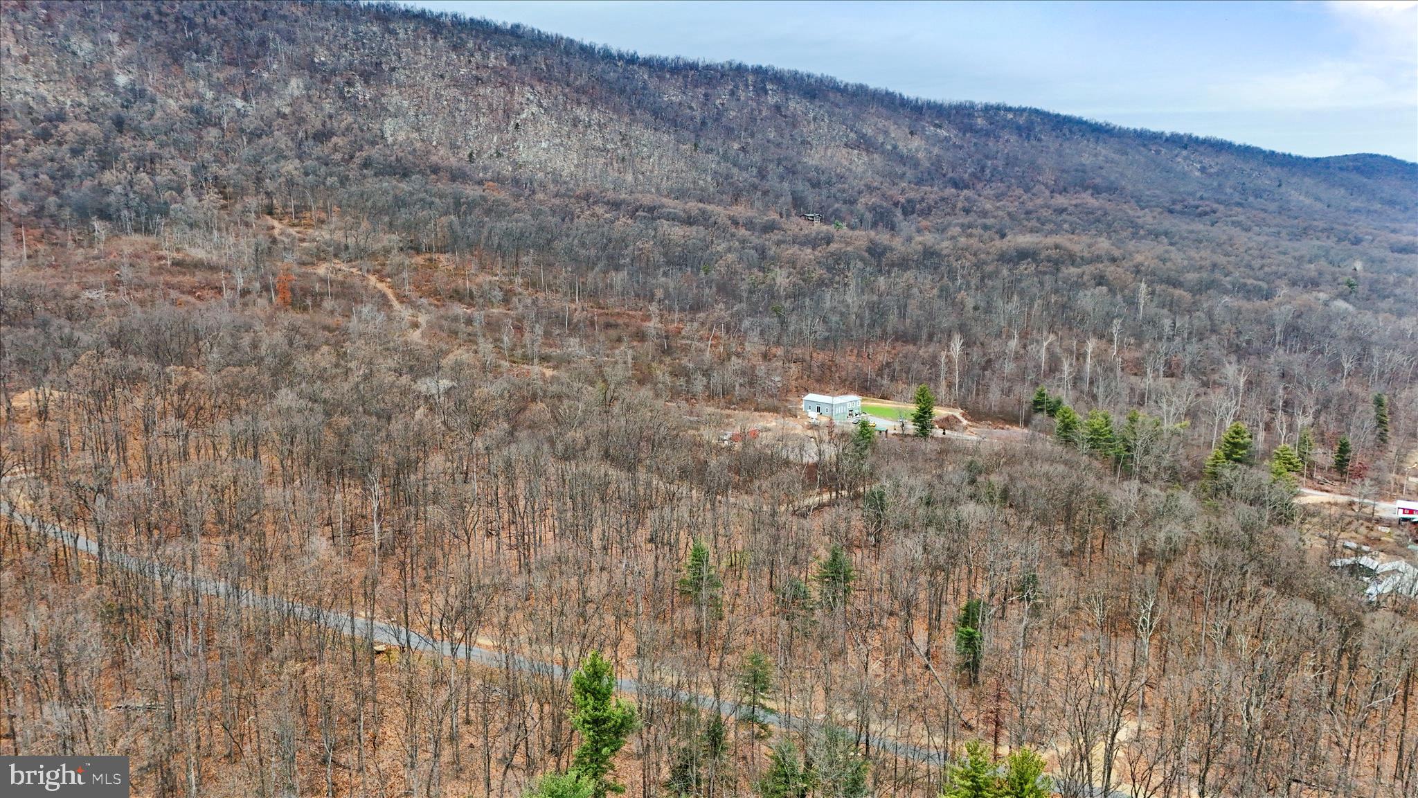 Bonaventure Way Berkeley Springs, WV 25411 - Photo 12 of 18 a view of a dry yard with trees in the background