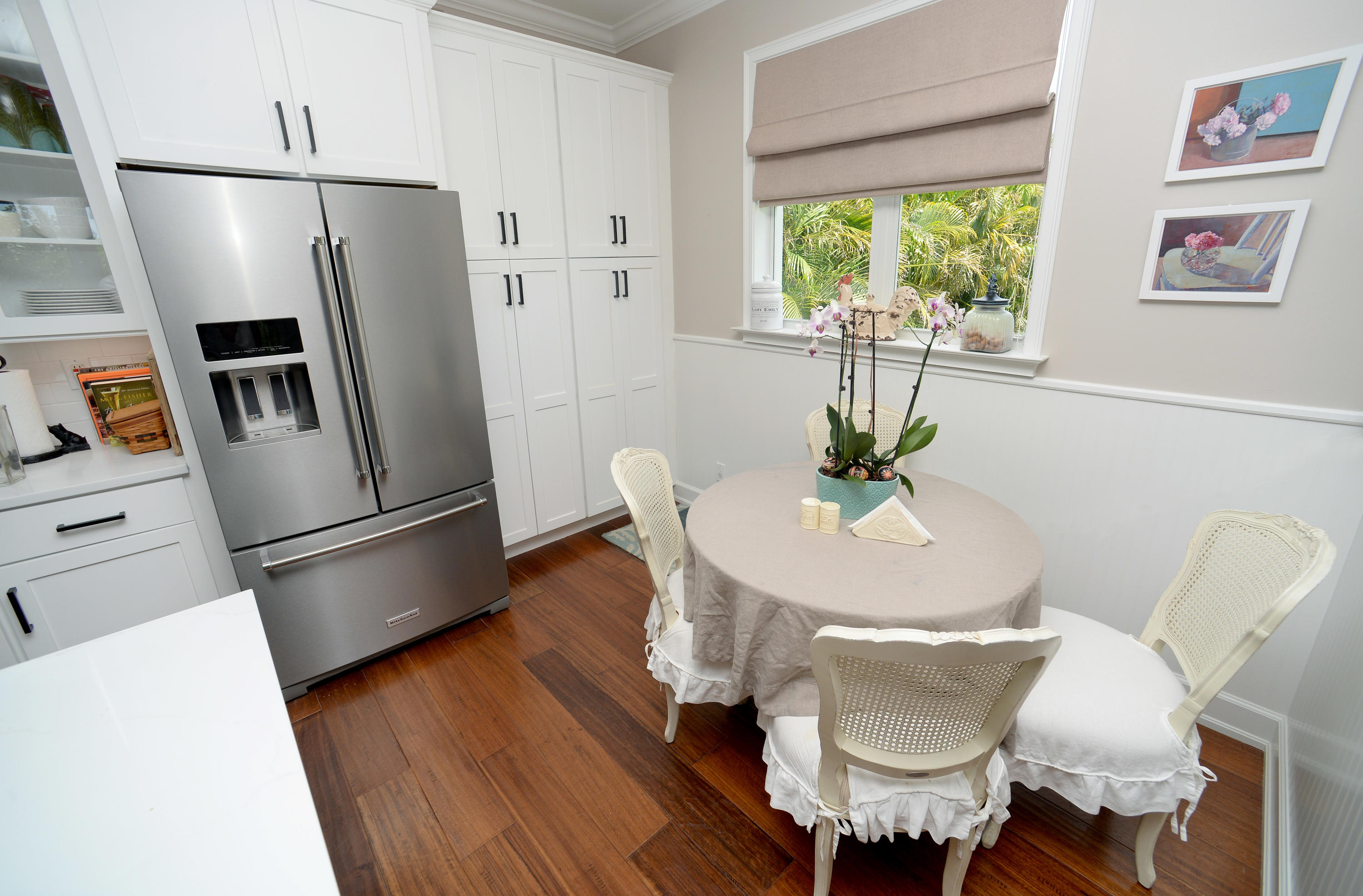 207 Killane Drive Jupiter, FL 33458 - Photo 36 of 59 a kitchen with stainless steel appliances a refrigerator a sink a dining table and a refrigerator