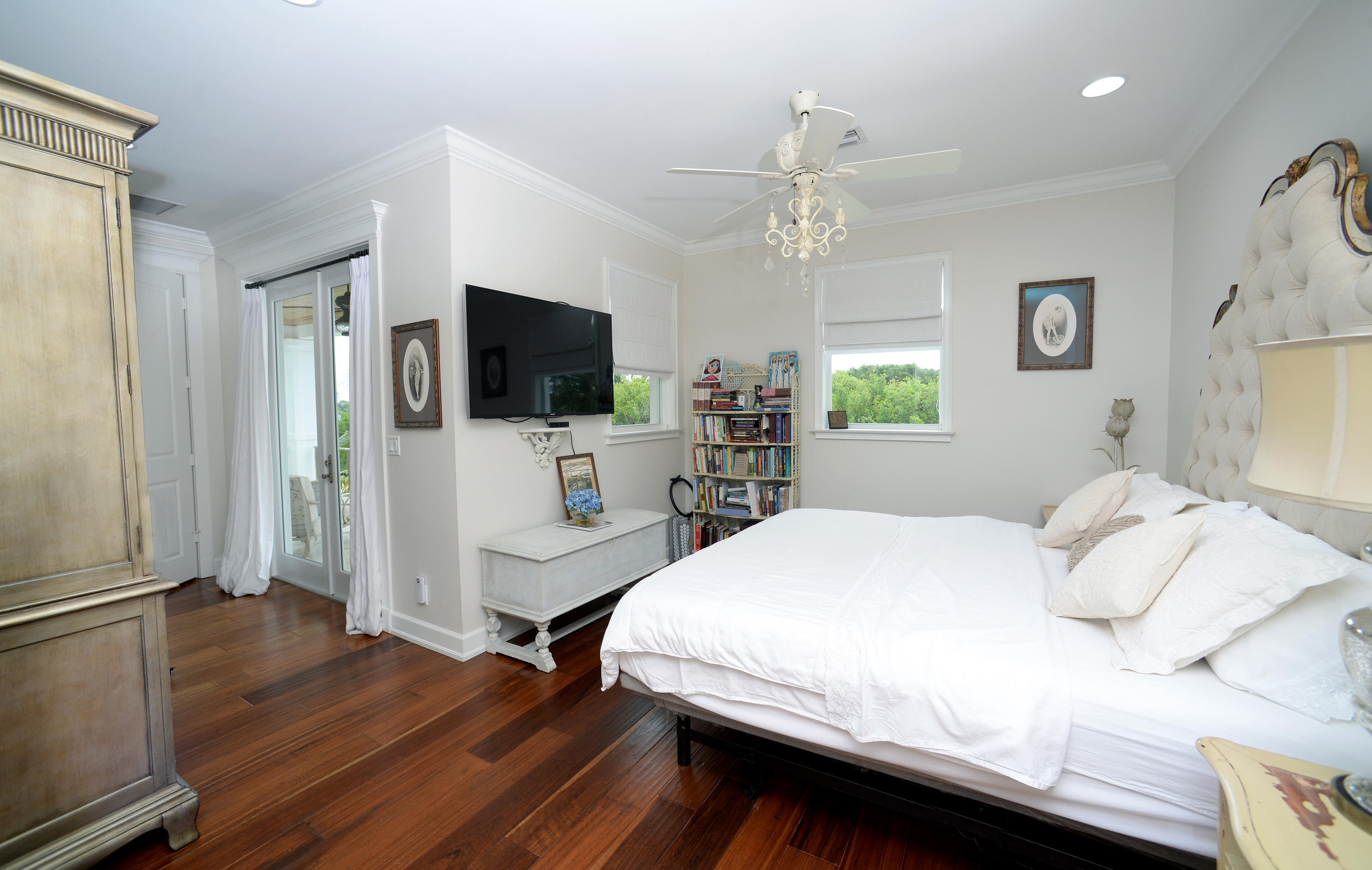 207 Killane Drive Jupiter, FL 33458 - Photo 40 of 59 a bedroom with a bed and a flat screen tv