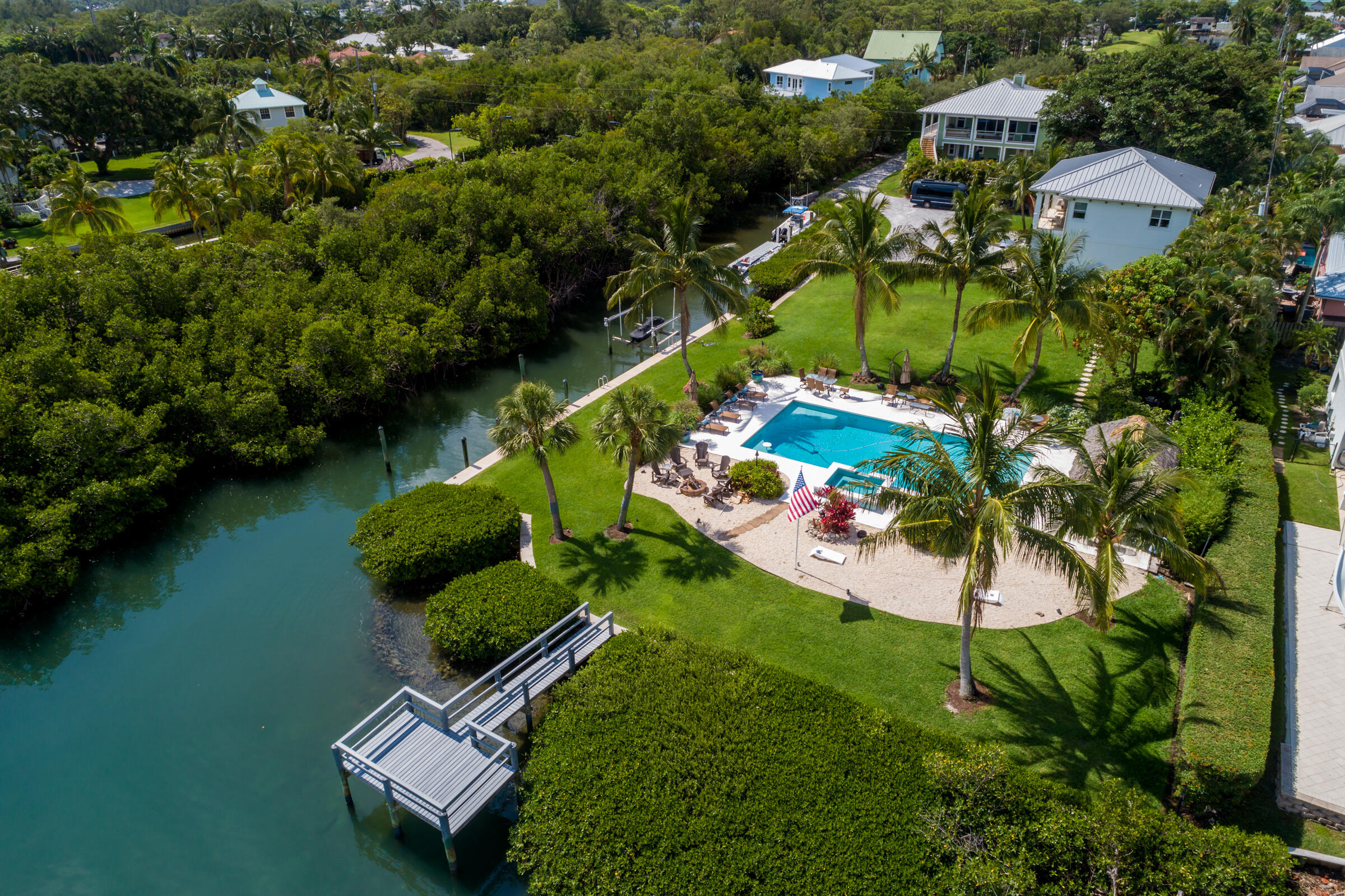 207 Killane Drive Jupiter, FL 33458 - Photo 9 of 59 an aerial view of a house with a garden and lake view