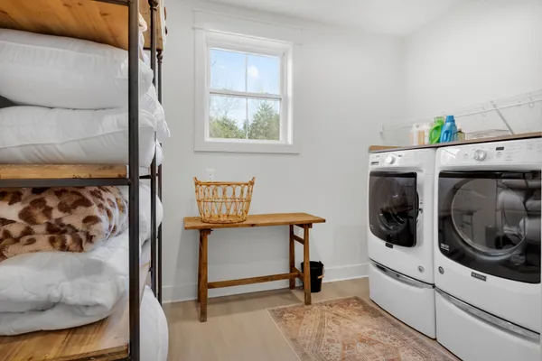 a bedroom with a bunk bed and a desk