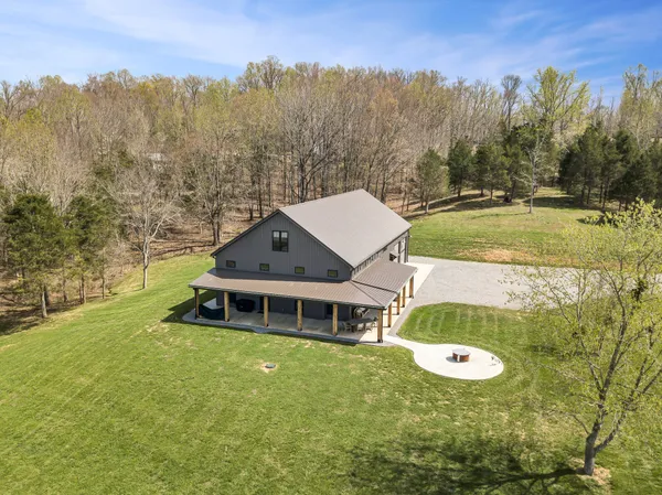 a aerial view of a house with a big yard