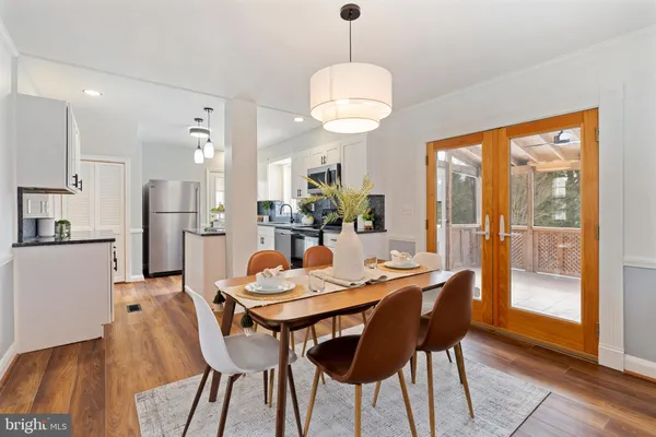 a view of a dining room with furniture window and wooden floor