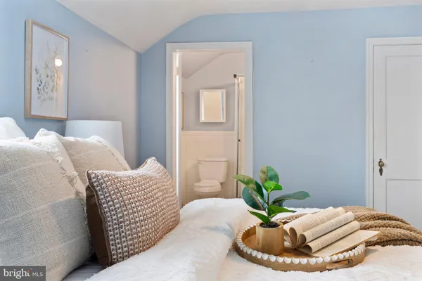 a bed room with a bed and a couch
