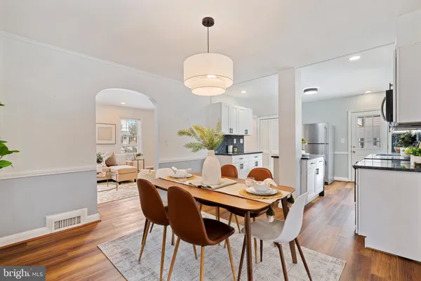 a dining room with furniture and window