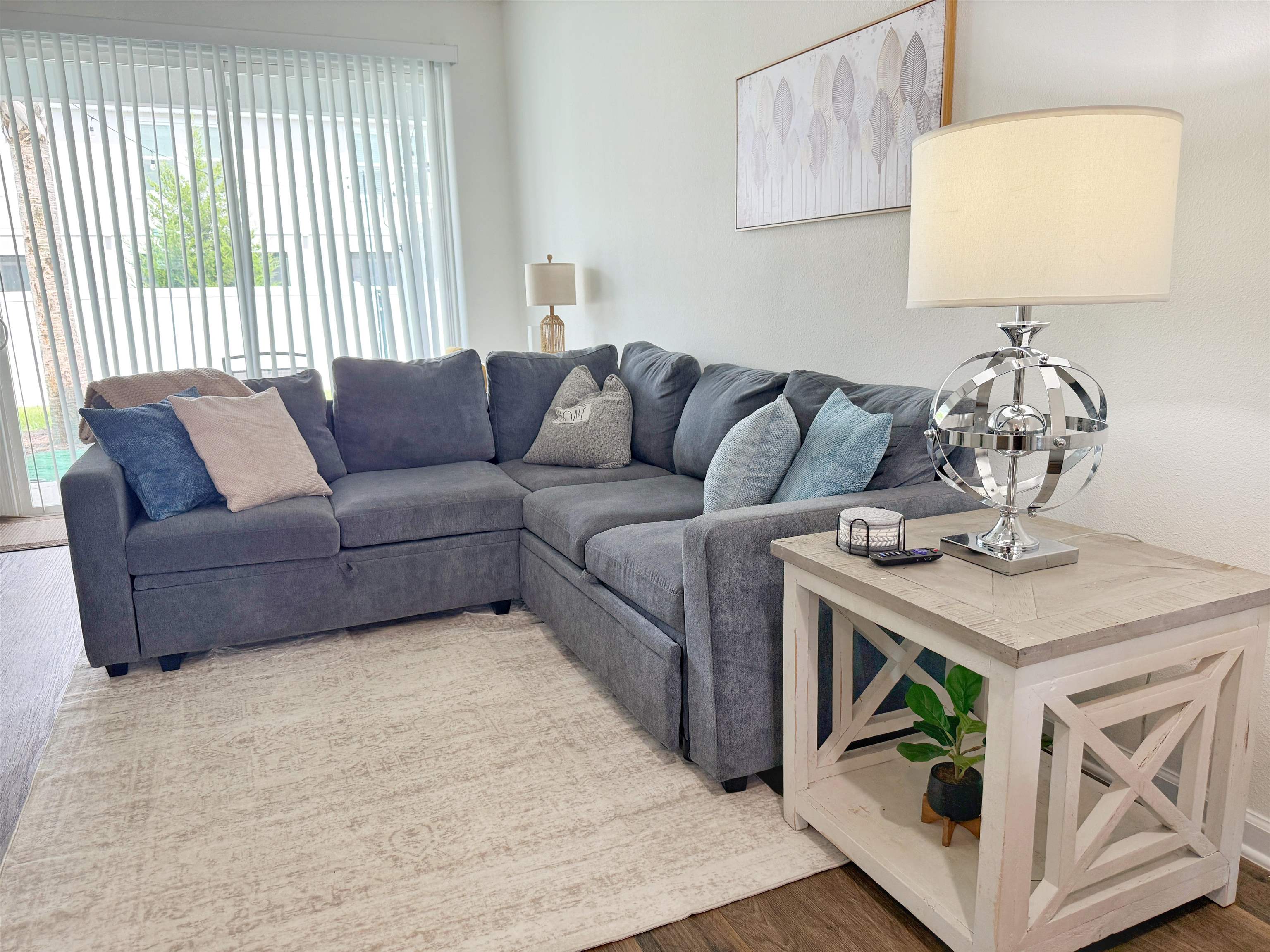 98 Vidalia Ridge Rd Street St. Augustine, FL 32084 - Photo 12 of 26 a living room with furniture and a wooden floor