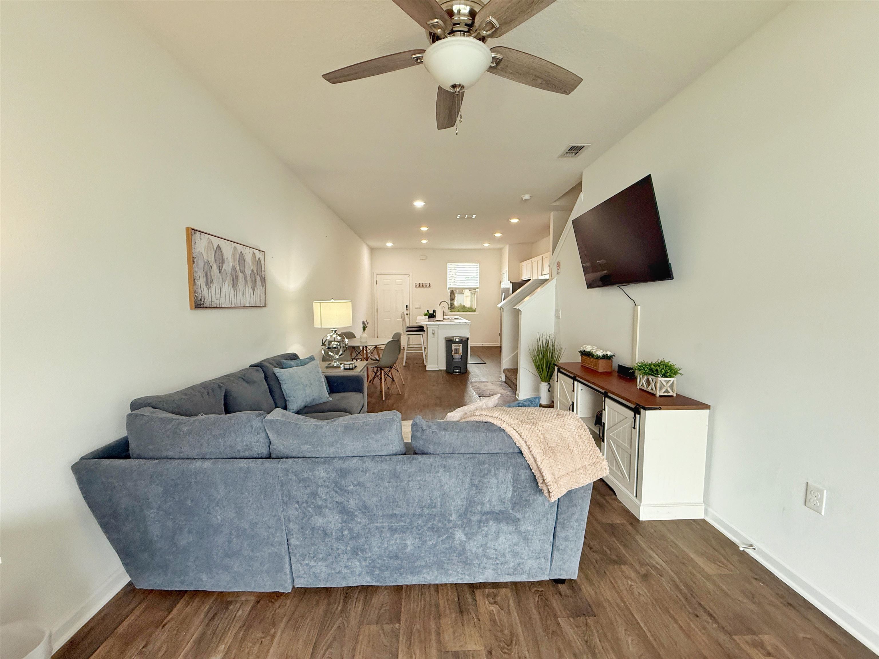 98 Vidalia Ridge Rd Street St. Augustine, FL 32084 - Photo 13 of 26 a living room with furniture and a flat screen tv