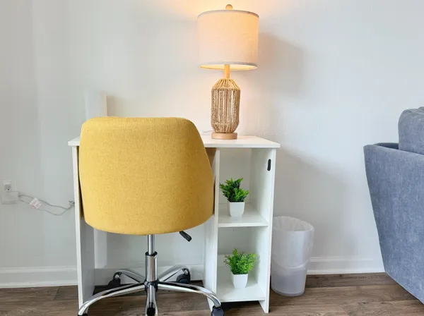 a view of living room with furniture and a table