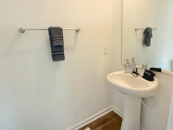 a bathroom with a sink and mirror