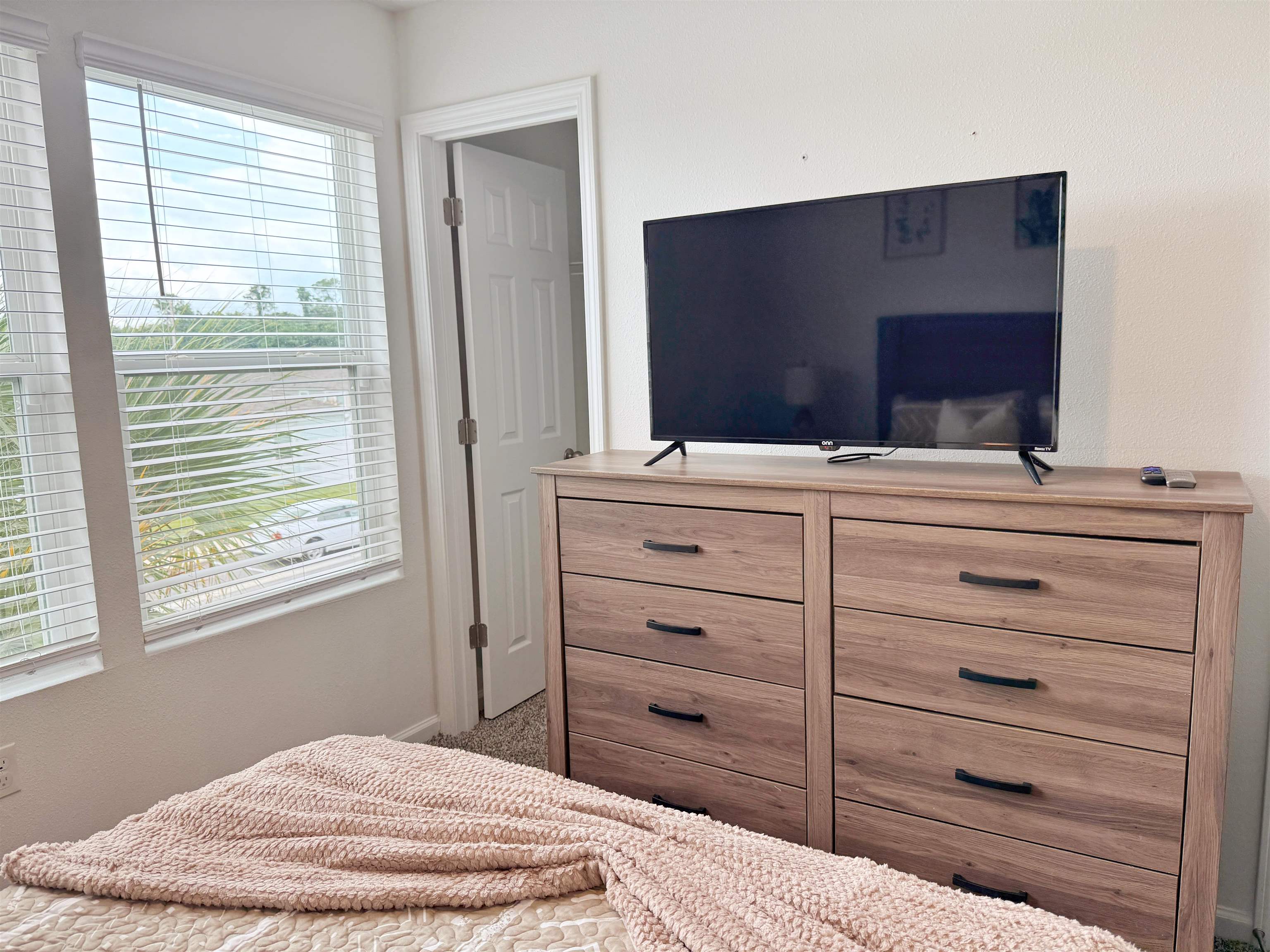 98 Vidalia Ridge Rd Street St. Augustine, FL 32084 - Photo 22 of 26 a bedroom with a bed and a flat screen tv