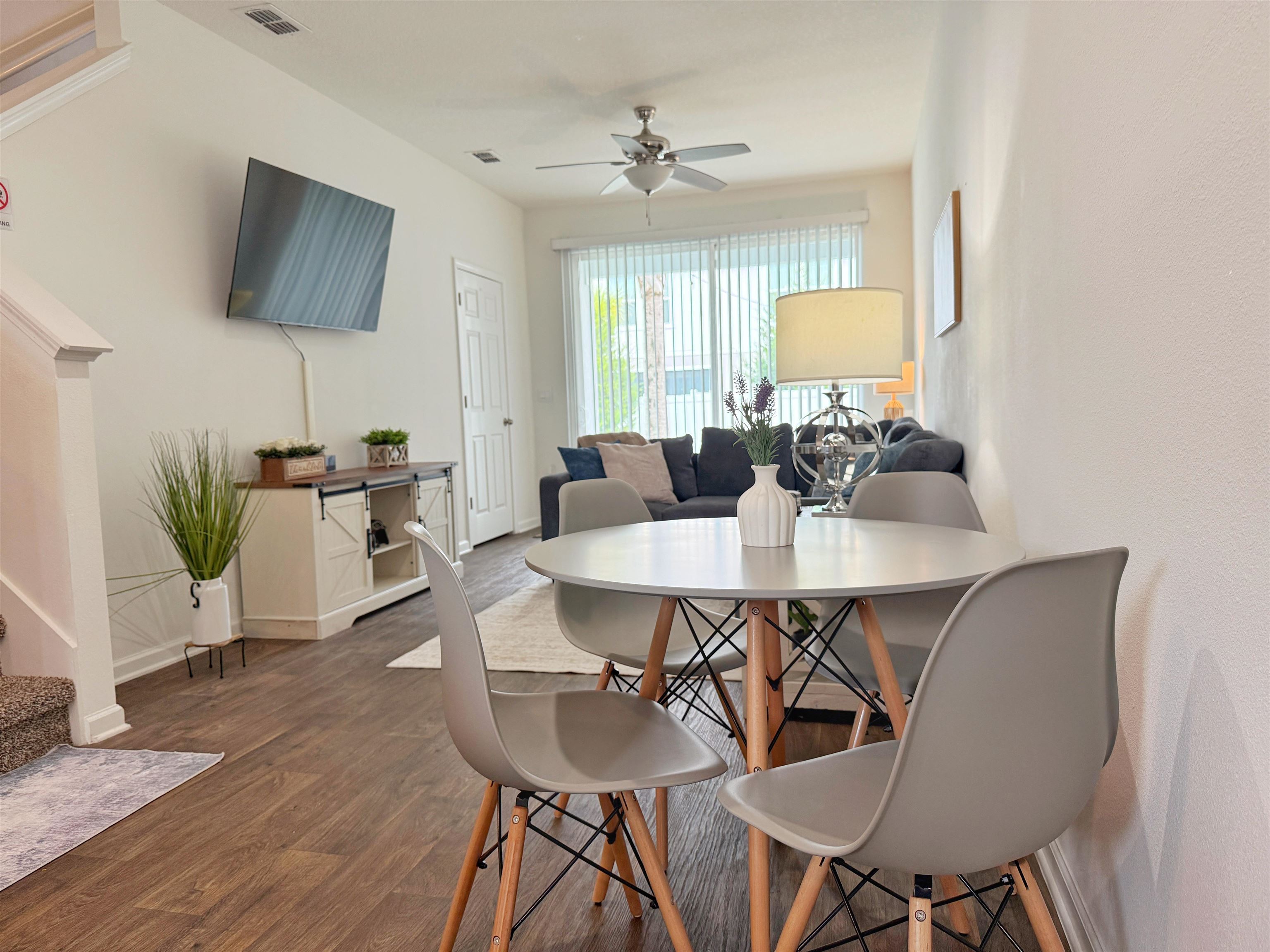 98 Vidalia Ridge Rd Street St. Augustine, FL 32084 - Photo 9 of 26 a view of a dining room with furniture and wooden floor