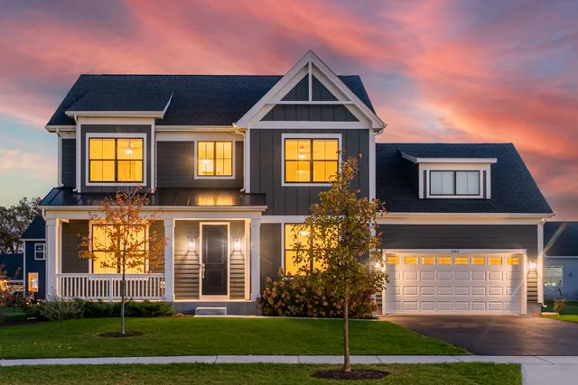 a front view of a residential apartment building with a yard