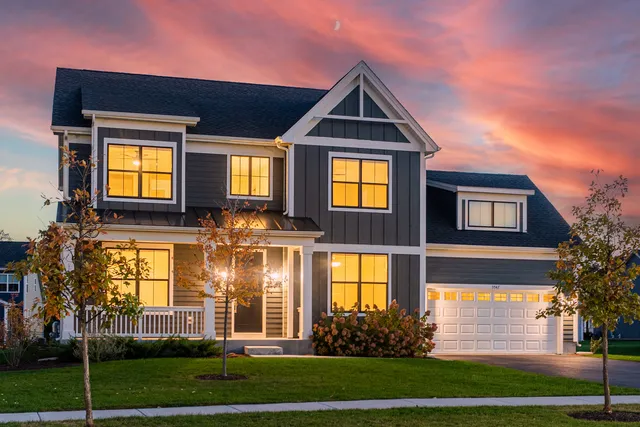 a aerial view of a house with a yard