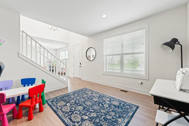 a living room with furniture and a rug