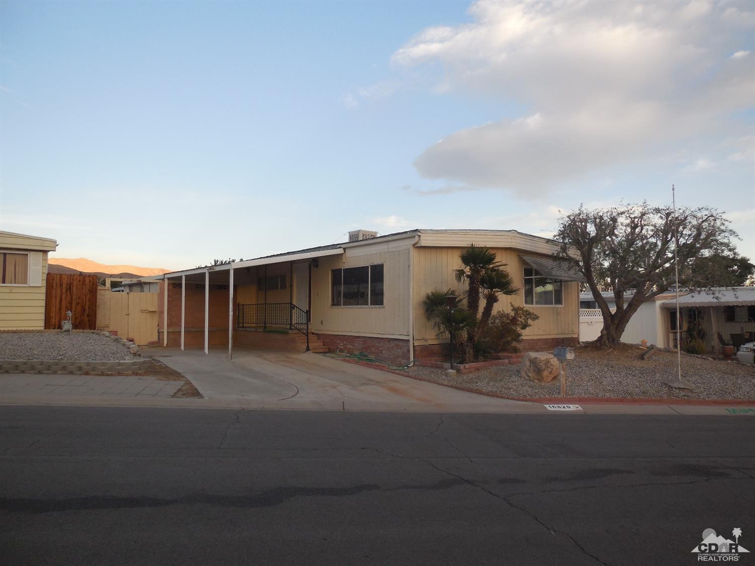 16820 Sunrise Road Desert Hot Springs, CA 92241 - Photo 2 of 19 a view of a house with backyard