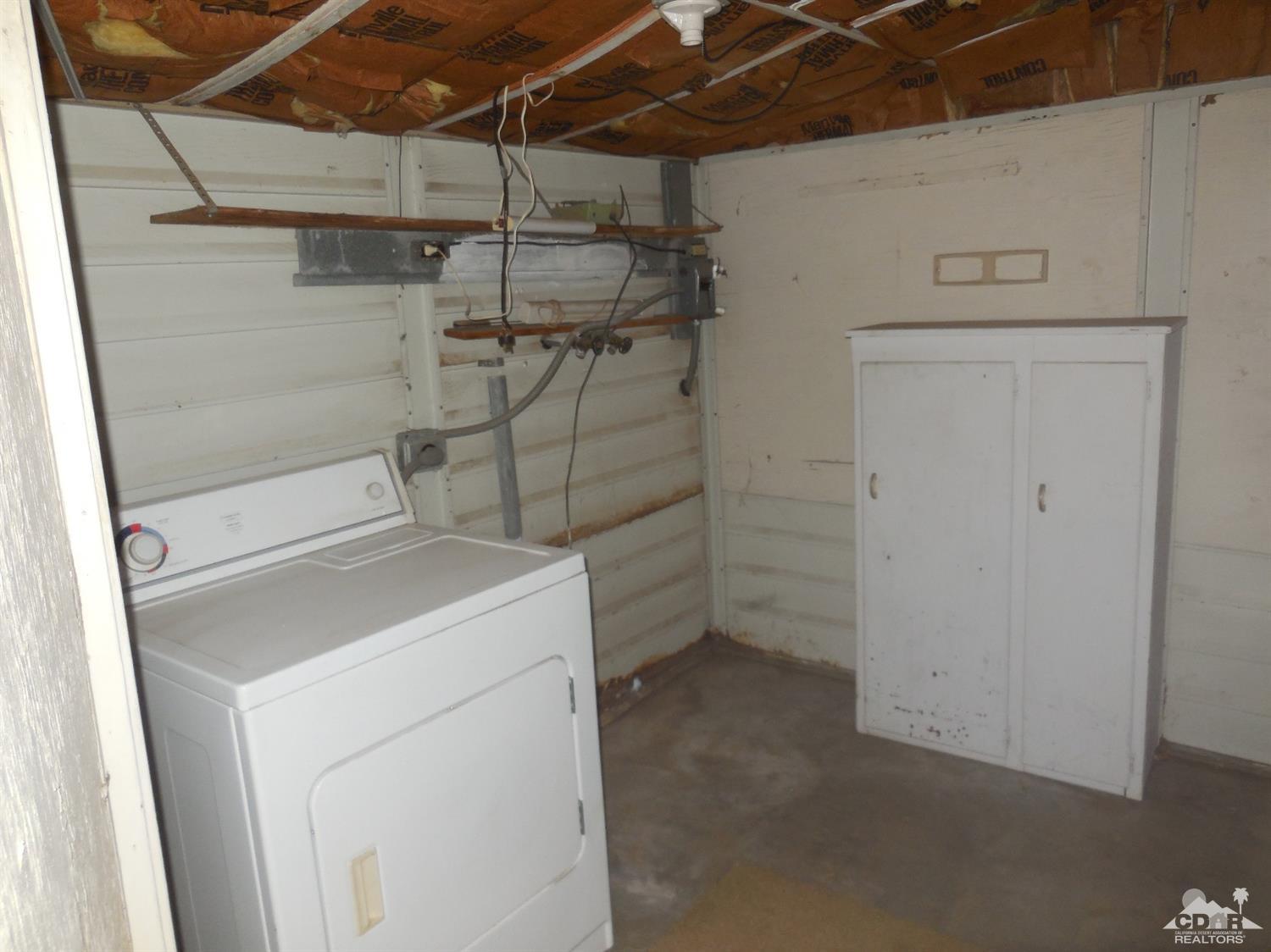 16820 Sunrise Road Desert Hot Springs, CA 92241 - Photo 15 of 19 a utility room with dryer and washer