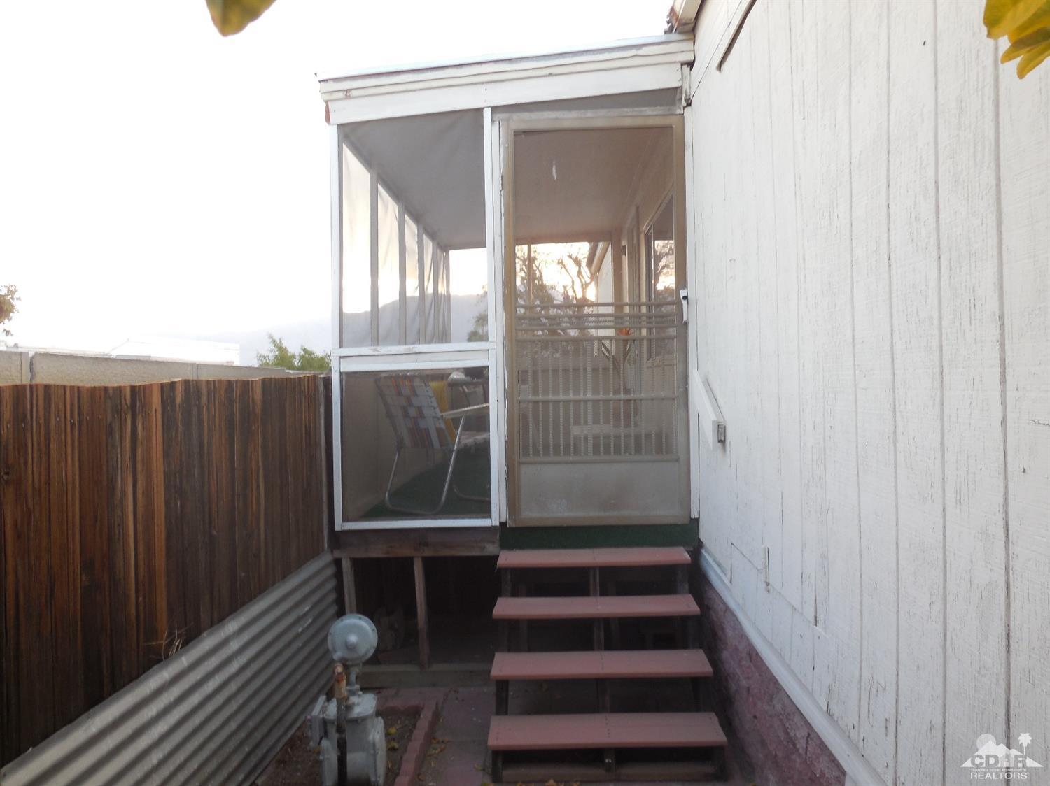 16820 Sunrise Road Desert Hot Springs, CA 92241 - Photo 17 of 19 a view of entryway with wooden floor