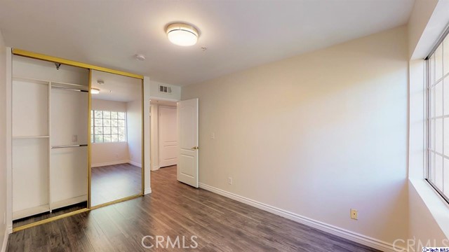 1245 Grandview Avenue, Unit 4 Glendale, CA 91201 - Photo 11 of 20 a view of an empty room and wooden floor