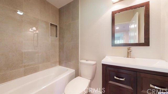 1245 Grandview Avenue, Unit 4 Glendale, CA 91201 - Photo 12 of 20 a bathroom with a sink a toilet and shower