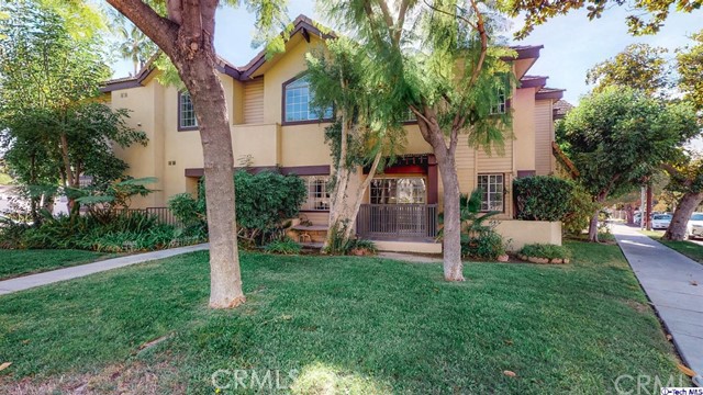 1245 Grandview Avenue, Unit 4 Glendale, CA 91201 - Photo 15 of 20 a front view of a house with garden