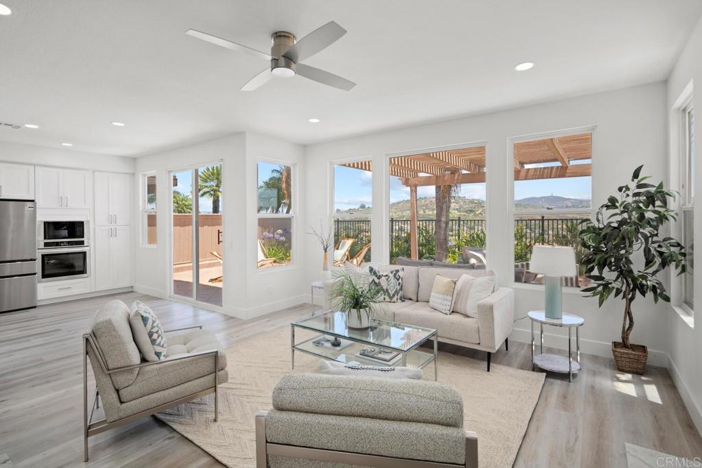 6160 Paseo Tapajos Carlsbad, CA 92009 - Photo 13 of 28 a living room with furniture and a large window