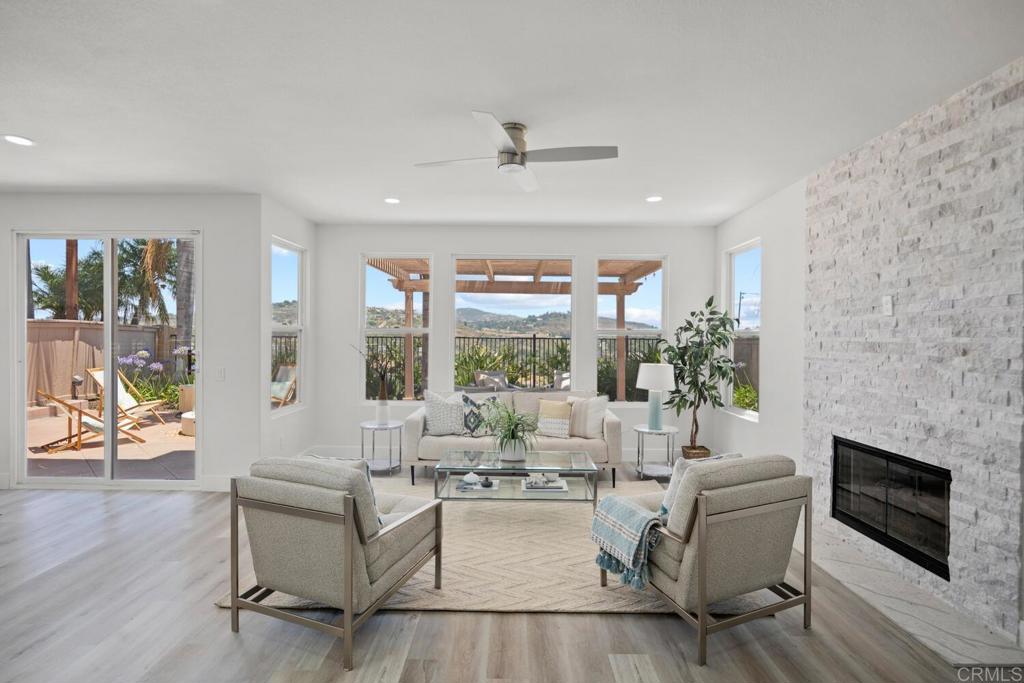 6160 Paseo Tapajos Carlsbad, CA 92009 - Photo 14 of 28 a living room with fireplace furniture and a fireplace