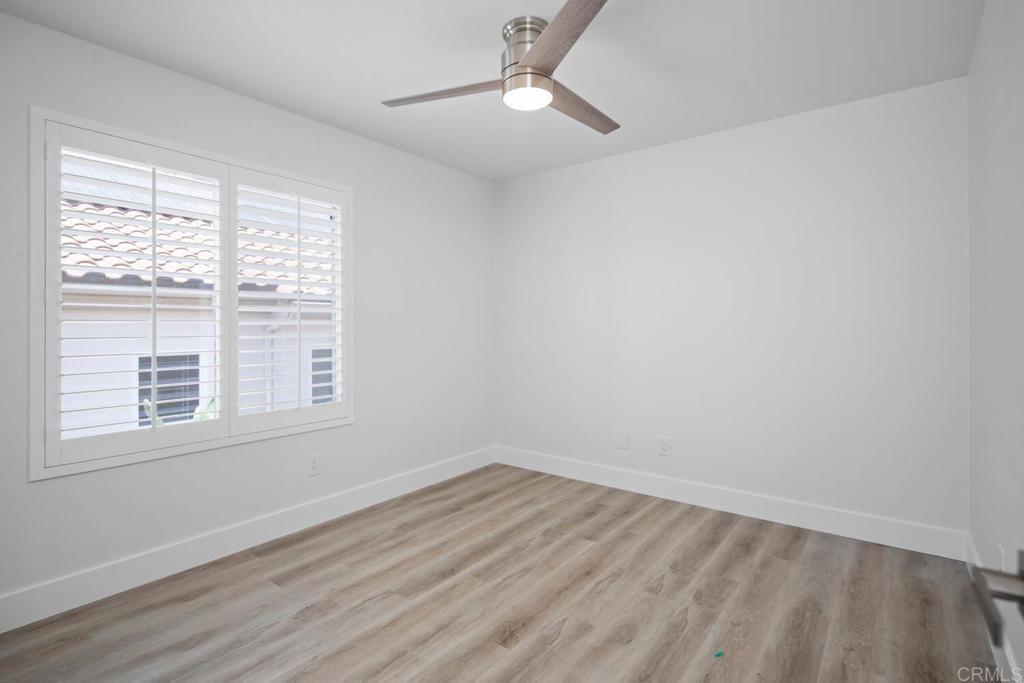 6160 Paseo Tapajos Carlsbad, CA 92009 - Photo 20 of 28 wooden floor in an empty room with a window
