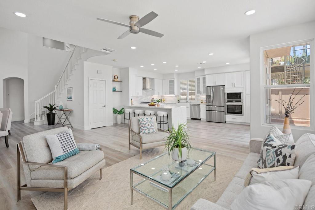 6160 Paseo Tapajos Carlsbad, CA 92009 - Photo 6 of 28 a living room with furniture kitchen view and a large window