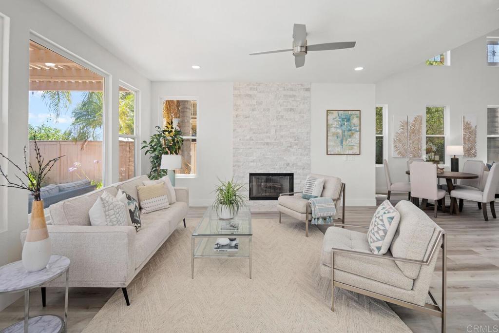 6160 Paseo Tapajos Carlsbad, CA 92009 - Photo 7 of 28 a living room with furniture and a large window