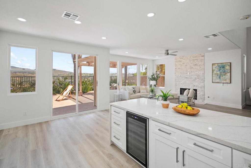 6160 Paseo Tapajos Carlsbad, CA 92009 - Photo 9 of 28 a kitchen with a sink and wooden floor