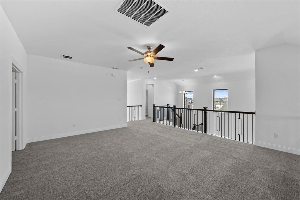 937 Mumms Drive Justin, TX 76247 - Photo 18 of 26 a view of a livingroom with a ceiling fan