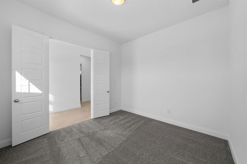 937 Mumms Drive Justin, TX 76247 - Photo 21 of 26 an empty room with windows